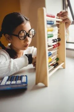 Schoolchild using a slide rule Stock Photos