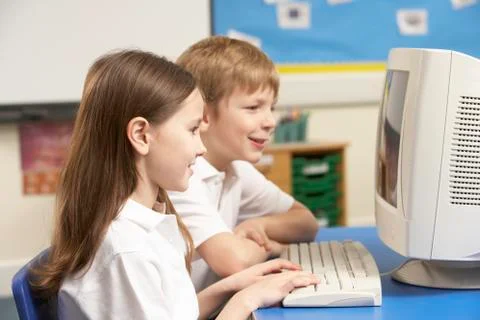 Schoolchildren In IT Class Using Computer 스톡 사진