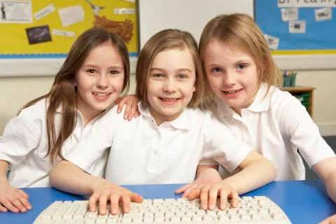 Schoolchildren in IT Class Using Computers Stock Photos
