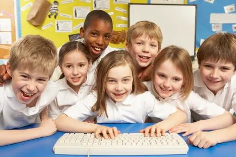 Schoolchildren in IT Class Using Computers Stock Photos