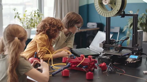 Schoolchildren Programming Robot Using Laptop Video stock 153468296