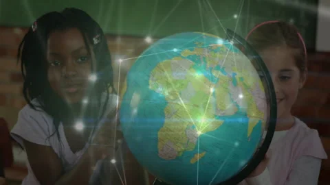 Schoolchildren reaching spinning globe in class, generating node overlay and Stock Footage 312083105