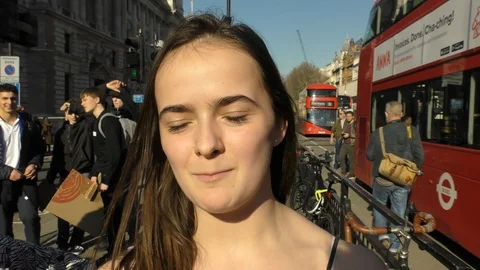 Schoolchildren stage sit-down protest outside UK Houses of Parliament Stock Footage 109274019