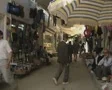 Schoolchildren walking through market passage SD Footage