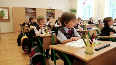 Schoolchilds in classroom Video stock 12534516