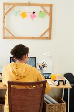 Schoolgirl Doing Homework for Programming Class 写真素材