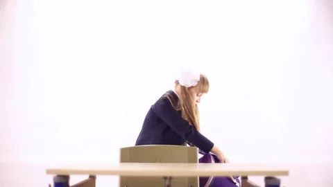 Schoolgirl with a huge backpack Stock Footage 72268555