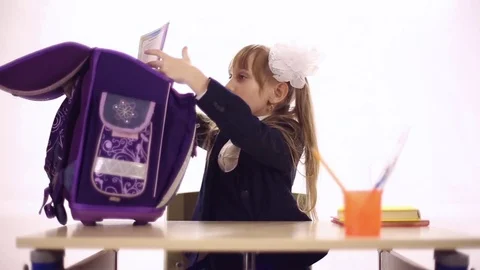 Schoolgirl with a huge backpack Stock Footage 72268871