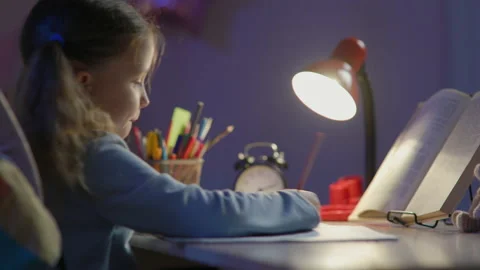 Schoolgirl Junior School Does Homework In The Evening Stock Footage 150043507