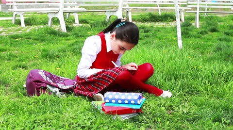 Schoolgirl in the park. Stock Footage 24665474