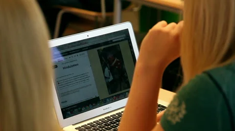 Schoolgirl in school using a laptop for studying Stock Footage 45161096