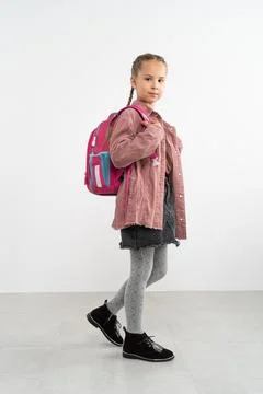Schoolgirl with schoolbag in Studio Stock Photos