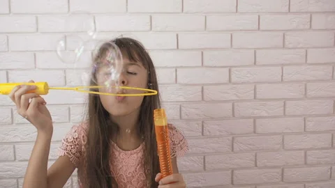 Schoolgirl with soap bubbles. Stock Footage 103264555