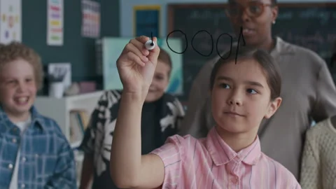 Schoolgirl Solving Addition Problem During Math Lesson in Class Stock Footage 312056172