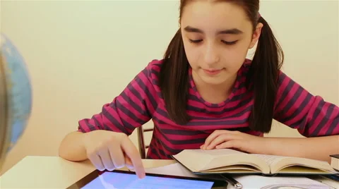 Schoolgirl studying with tablet pc 스톡 동영상 47028524