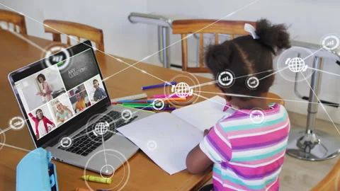 Schoolgirl taking notes in online lesson while network icon appearing on laptop Stock Footage 316186262