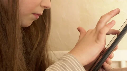 Schoolgirl using a tablet Stock Footage 170382303