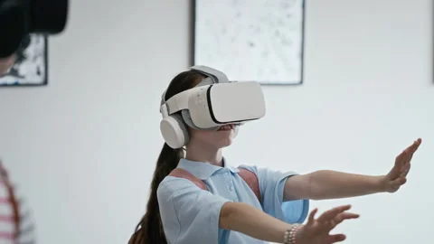 Schoolgirl Wearing Vr Headset Exploring Virtual Art in Gallery Stock Footage 343609907