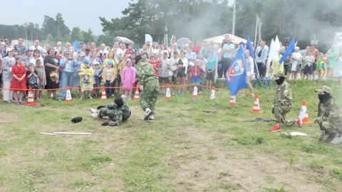 Schoolgirls demonstrate elements of military training in the smoke. Stock Footage 247007091