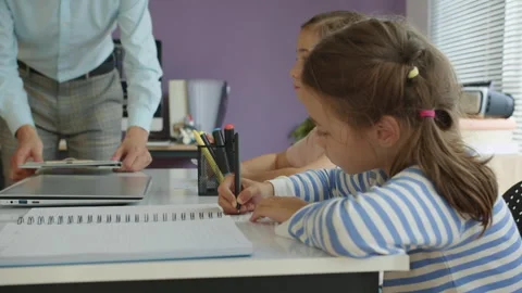 Schoolgirls Taking Test on Paper at Programming Class Stock Footage 280543629