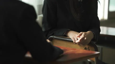 Schoolgirls talking in the classroom Stock Footage 162280657