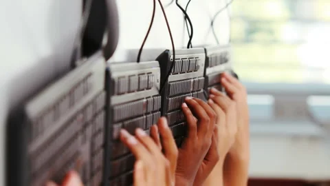 Schoolgirls using computer in classroom 스톡 동영상 301361417