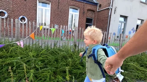 Schoolkid run to school hand in hand with his dad Stock Footage 139329266