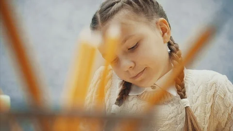 Schoolkid is taking one of the pencils. Stock Footage 113080716