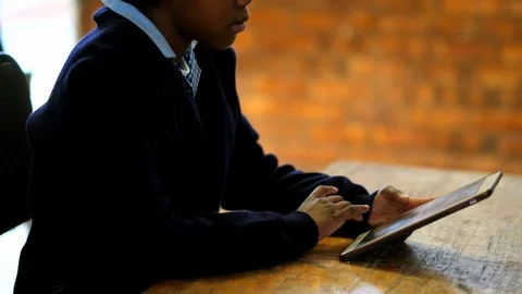Schoolkid using digital tablet in classroom 4k Stock Footage 97925330