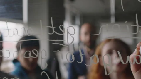 Schoolkids Discussing Programming Sequence and Writing on Glass Stock Footage 278130081
