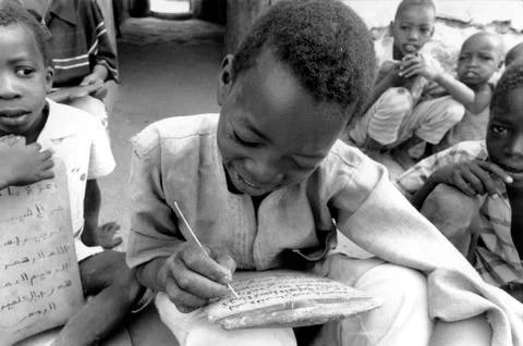 Schools boy practicing arabic texts ata koranic Stock Photos
