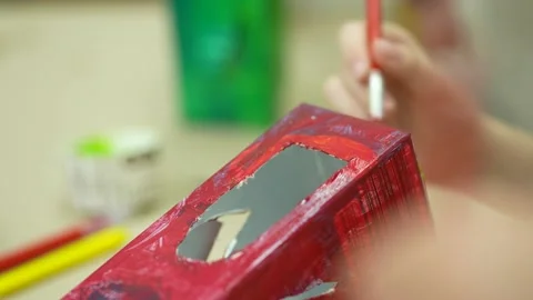 Schoolwork of painting recyclable boxes Stock Footage 205919162
