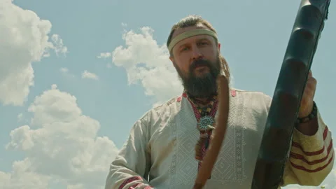 A schuman man plays a shamanic drum, tries to make it rain, worship the old gods Stock Footage 160167742
