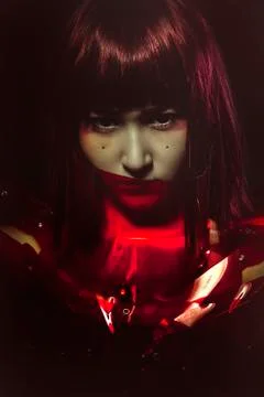 Sci-fi cyborg, sensual future woman in red armor, science fiction Stock Photos