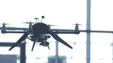 Sci-fi drone hovering in slow motion indoors Stock Footage 106392926