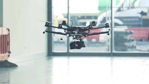 Sci-fi drone octocopter ascending in slow motion indoors Stock Footage 106392938
