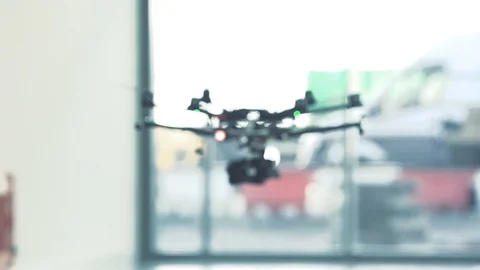 Sci-fi drone octocopter ascending in slow motion indoors pull focus Stock Footage 106392985