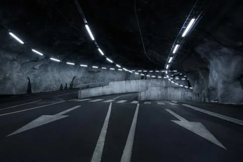 Sci fi looking dark and moody underground parking lot with fluorescent lights Stock Photos