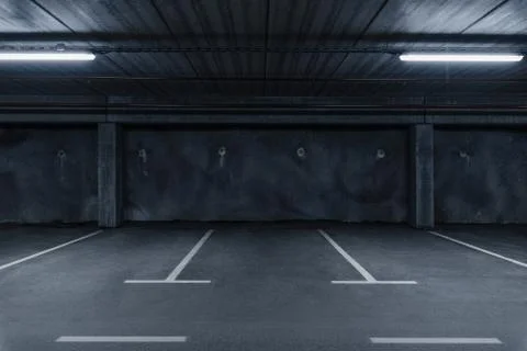 Sci fi looking dark and moody underground parking lot with fluorescent lights Stock Photos