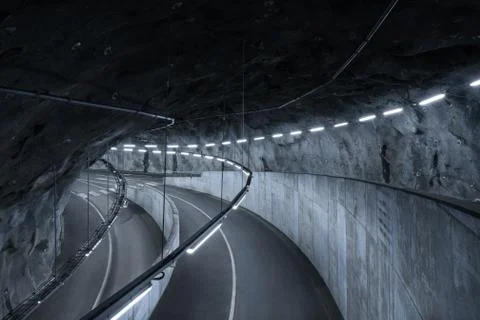 Sci fi looking dark and moody underground parking lot with fluorescent lights Stock Photos