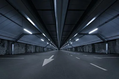 Sci fi looking dark and moody underground parking lot with fluorescent lights Stock Photos