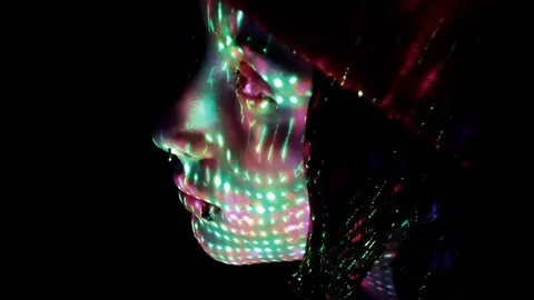 Sci-fi looking shot of lights on teen's face Stock Footage 80806962