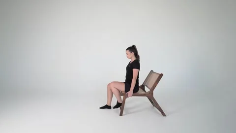 Sciatic nerve flossing (nerve glide) with a chair Stock Footage 314194411