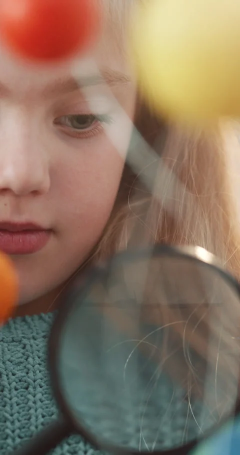 Science, child or molecule with magnifying glass in classroom for atom study, Stock Footage 336695607