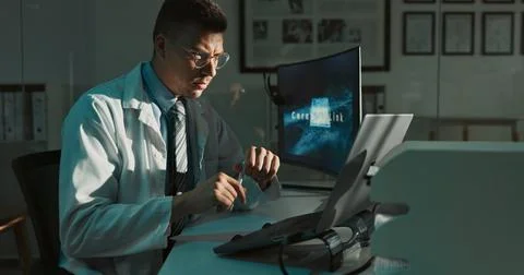 Science, computer and man in lab at night for medical research, innovation and Foto stock