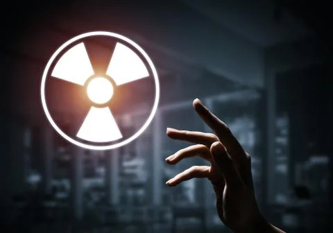 Science concept presented by atom symbol on dark interior backgr Stock Photos
