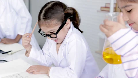 Science education in laboratory lab with elementary diversity students in c.. Stock Footage 243553956