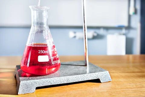 Science equipment on the table including a beaker Stock Photos