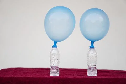 Science experiment about balloons Stock Photos