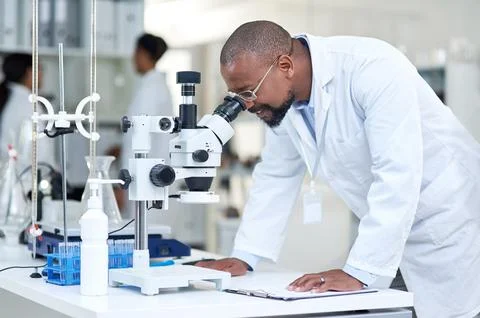 Science, experiment and black man in lab with microscope, sample test or bi.. Stock Photos